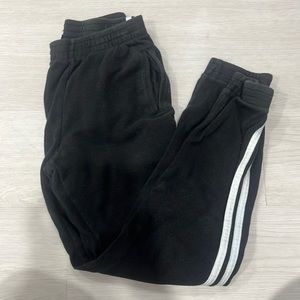 Black sweatpants with white stripes